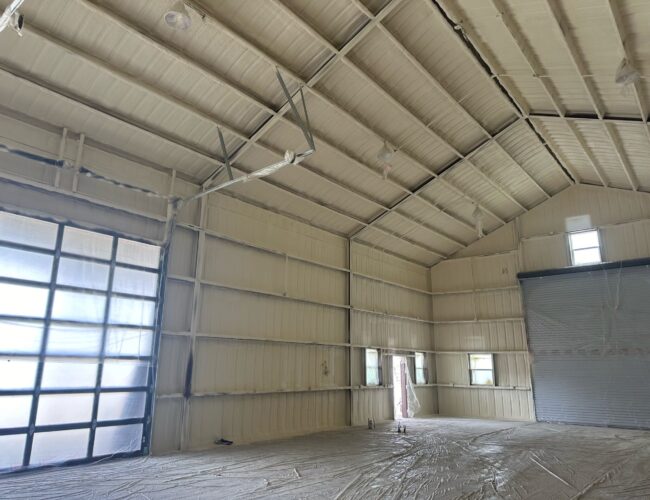 Large garage space insulated with spray foam.